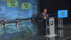 Steven Furtick surrounds his pulpit with branded ads for his book.